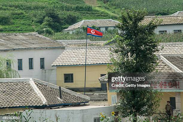 North Korea National Flag is flown at a small town on August 24, 2015 in Pyongyang, North Korea. North and South Korea today came to an agreement to...