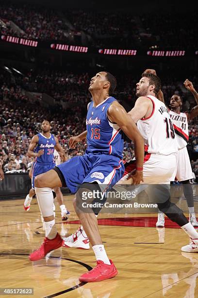 Ryan Hollins of the Los Angeles Clippers boxes out against Joel Freeland of the Portland Trail Blazers during the game on April 16, 2014 at the Moda...