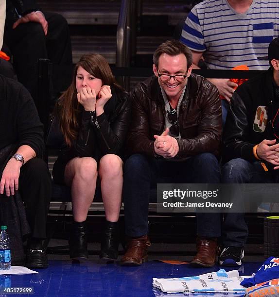 Christian Slater and daughter Eliana Sophia attend the Toronto Raptors vs New York Knicks game at Madison Square Garden on April 16, 2014 in New York...