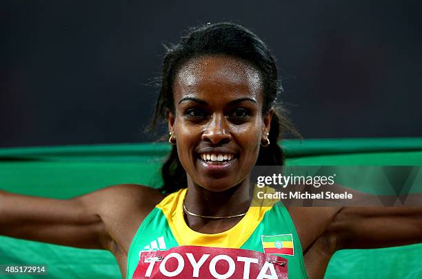 Genzebe Dibaba of Ethiopia celebrates after winning gold in the Women's 1500 metres final during day four of the 15th IAAF World Athletics...