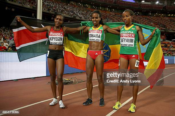 Silver medalist Faith Chepngetich Kipyegon of Kenya, gold medalist Genzebe Dibaba of Ethiopia and Dawit Seyaum of Ethiopia celebrate after the...