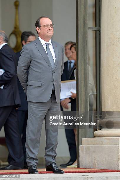 French President Francois Hollande looks on as United Nations Secretary General Ban Ki-Moon leaves the Elysee Palace after a lunch on August 25, 2015...