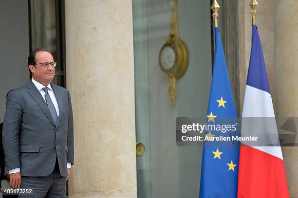 French President Francois Hollande looks on as United Nations Secretary General Ban Ki-Moon leaves the Elysee Palace after a lunch on August 25, 2015...