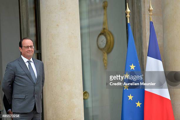 French President Francois Hollande looks on as United Nations Secretary General Ban Ki-Moon leaves the Elysee Palace after a lunch on August 25, 2015...