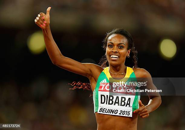 Genzebe Dibaba of Ethiopia celebrates after winning gold in the Women's 1500 metres final during day four of the 15th IAAF World Athletics...