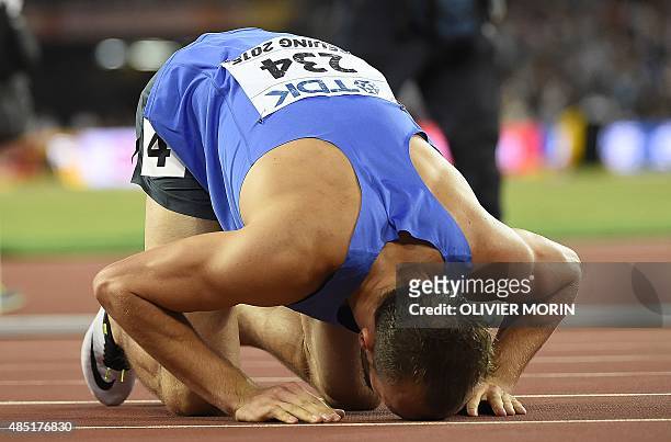 Bronze medallist Bosnia-Herzegovina's Amel Tuka celebrates after the final of the men's 800 metres athletics event at the 2015 IAAF World...