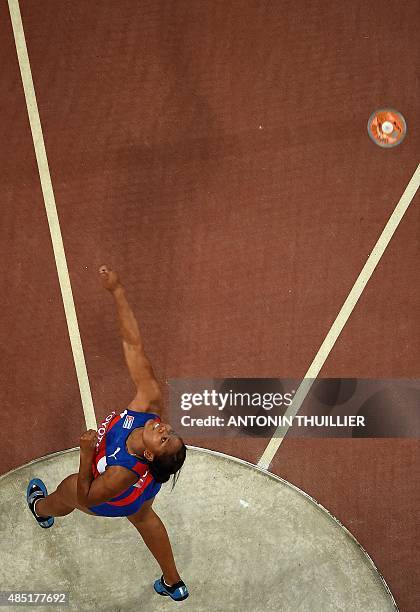 Cuba's Denia Caballero competes in the final of the women's discus throw athletics event at the 2015 IAAF World Championships at the "Bird's Nest"...