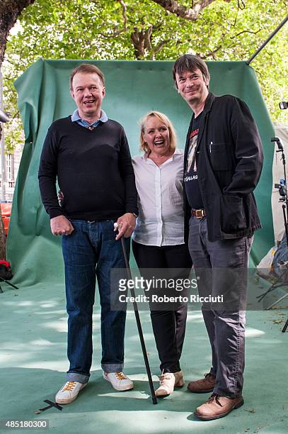 Scottish musician and producer Edwyn Collins, Grace Maxwell and Ian Rankin attend a photocall at Edinburgh International Book Festival on August 25,...