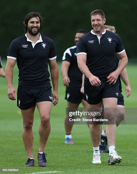 Bakkies Botha and Jacques Potgieter of the Barbarians share a joke during a Barbarians training session at Latymer Upper School sports ground on...