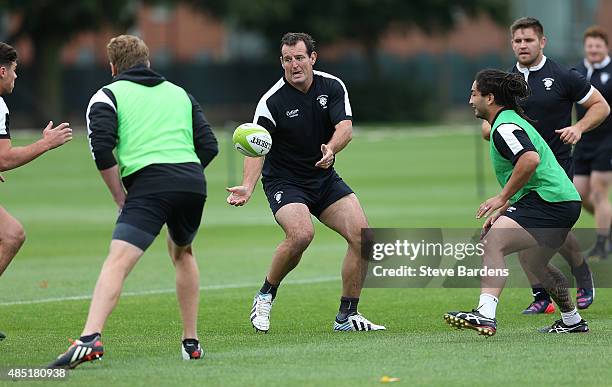 Carl Hayman of the Barbarians passes the ball during a Barbarians training session at Latymer Upper School sports ground on August 25, 2015 in...