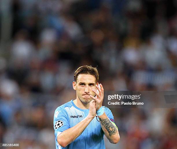 Lucas Biglia of SS Lazio greets the fans after the UEFA Champions League qualifying round play off first leg match between SS Lazio and Bayer...