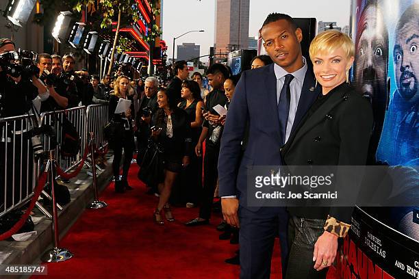 Marlon Wayans and Jaime Pressly walk the "A Haunted House 2" Los Angeles Premiere Red Carpet at Regal Cinemas L.A. Live on April 16, 2014 in Los...