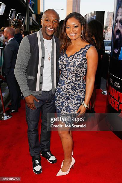 Floyd Mayweather Jr and Tamala Jones walk the "A Haunted House 2" Los Angeles Premiere Red Carpet at Regal Cinemas L.A. Live on April 16, 2014 in Los...