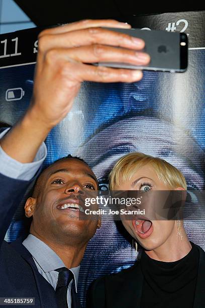 Marlon Wayans and Jaime Pressly take a selfie at the "A Haunted House 2" Los Angeles Premiere Red Carpet at Regal Cinemas L.A. Live on April 16, 2014...