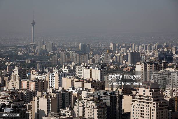 The Milad Tower, left, also known as the Tehran Tower, stands beyond residential and commercial properties on the city skyline in Tehran, Iran, on...