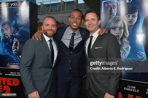 Director Michael Tiddes, Writer/Producer Marlon Wayans and Writer/Producer Rick Alvarez arrives to the premiere of Open Road Films' "A Haunted House...