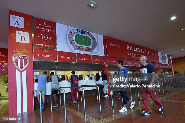 Fans queue to buy tickets prior to the UEFA Champions League qualifying round play off second leg match between Monaco and Valencia on August 25,...