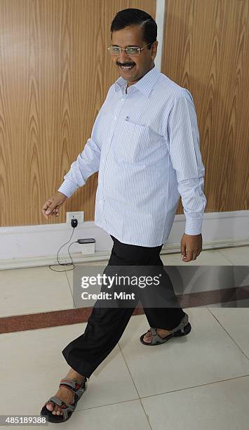 Delhi Chief Minister Arvind Kejriwal arrives for the Registration Ceremony of Airtel Half Marathon at his residence on August 25, 2015 in New Delhi,...