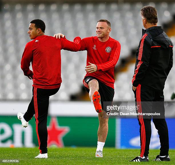 Manchester United Head Coach / Manager, Louis van Gaal , looks on as Wayne Rooney and Memphis Depay of Manchester United warm up during the...