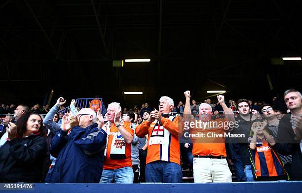 Luton fans applaud prior to the Capital One Cup second round match between Luton Town and Stoke City at Kenilworth Road on August 25, 2015 in Luton,...