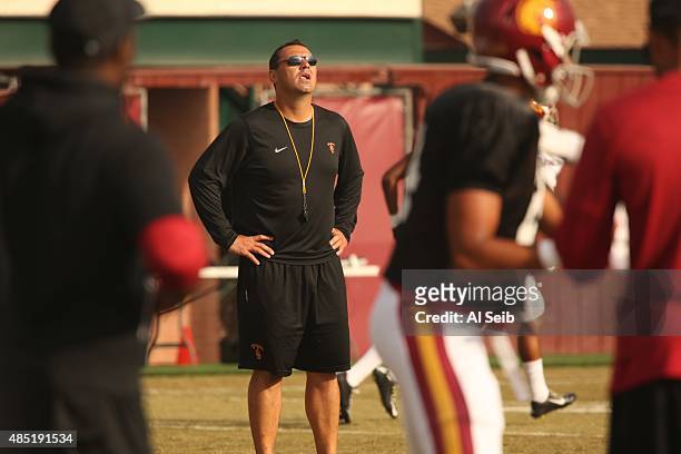 Football coach Steve Sarkisian with players during practice at USC Tuesday morning August 25, 2015. Sarkisian has been heavily criticized for...