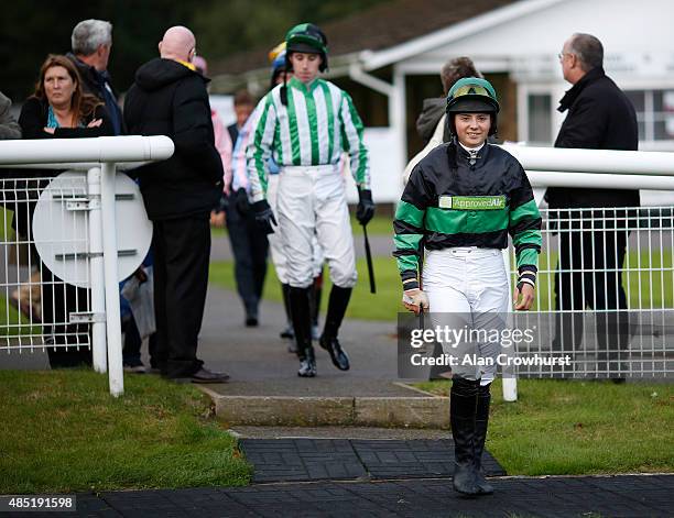 Bryony Frost enters the parade ring at Fontwell racecourse on August 25, 2015 in Fontwell, England.