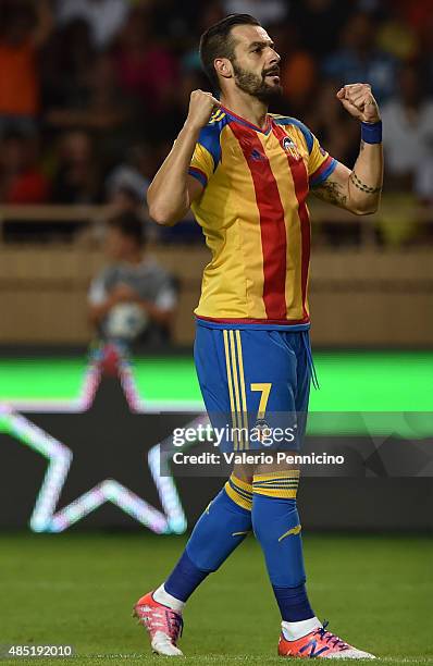 Alvaro Negredo of Valencia celebrates after scoring the opening goal during the UEFA Champions League qualifying round play off second leg match...