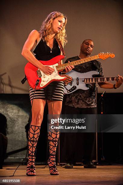 Ana Popovic and Carlton Armstrong performing with her band at the Stargazers Theater in Colorado Springs, Colorado on August 21, 2015.