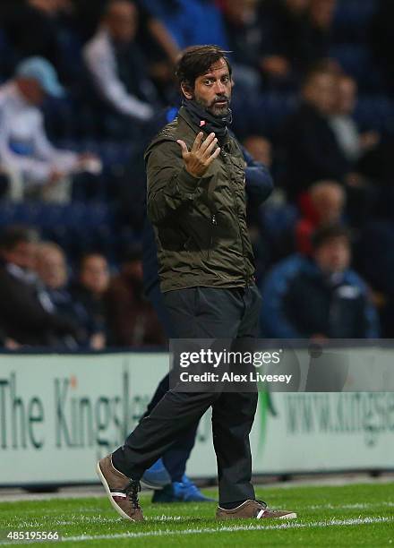 Quique Flores, manager of Watford looks on during the Capital One Cup Second Round match between Preston North End and Watford at Deepdale on August...