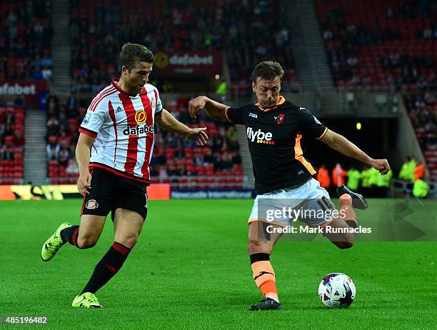 Adam Matthews of Sunderland blocks a cross from Lee Holmes of Exeter City during the Capital One Cup Second Round match between Sunderland and Exeter...