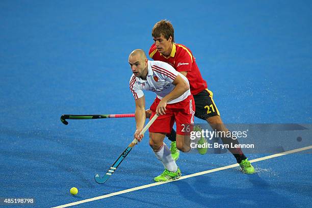 Nick Catlin of England is tackled byAlex Casasayas of Spain during the match between England and Spain on day five of the Unibet EuroHockey...