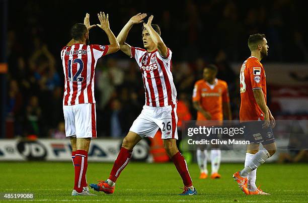 Marc Wilson and Philipp Wollscheid of Stoke City celebrate the goal scored by Jonathan Walters of Stoke City during the Capital One Cup second round...