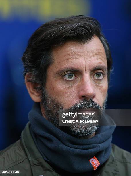 Quique Flores, manager of Watford looks on during the Capital One Cup Second Round match between Preston North End and Watford at Deepdale on August...