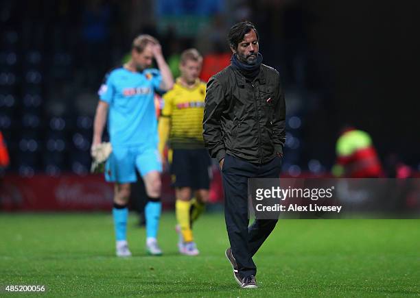 Quique Flores the manager of Watford walks off with his players after defeat to Preston North End in the Capital One Cup Second Round match between...