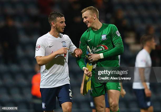 Winning goalscorer Marnick Vermijl of Preston North End jokes with Jordan Pickford after the Capital One Cup Second Round match between Preston North...