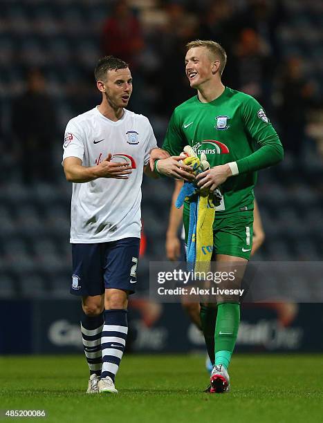 Winning goalscorer Marnick Vermijl of Preston North End jokes with Jordan Pickford after the Capital One Cup Second Round match between Preston North...