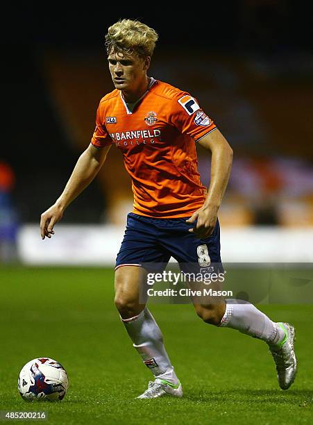 Cameron McGeehan of Luton Town in action during the Capital One Cup second round match between Luton Town and Stoke City at Kenilworth Road on August...