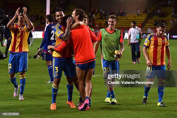 Players of Valencia celebrate victory at the end of the UEFA Champions League qualifying round play off second leg match between Monaco and Valencia...