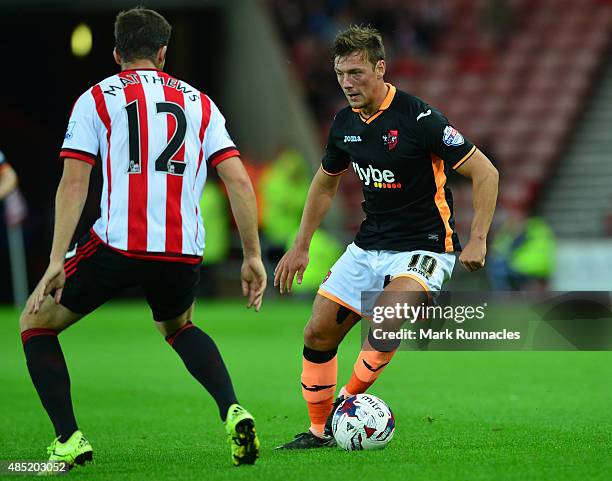 Lee Holmes of Exeter City takes on Adam Matthews of Sunderland during the Capital One Cup Second Round match between Sunderland and Exeter City at...