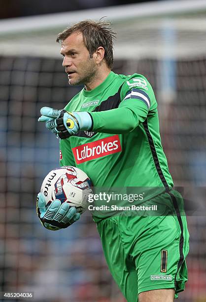 Roy Carroll of Notts County gathers the ball during the Capital One Cup second round match between Aston Villa and Notts County at Villa Park on...