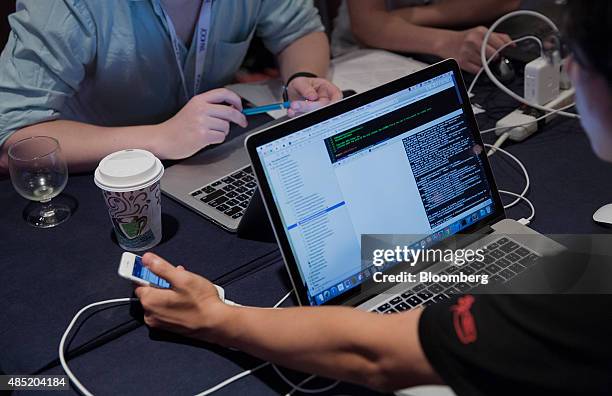 Attendees working on Apple Inc. Laptop computers participate in the Yahoo! Inc. Mobile Developer Conference Hackathon in New York, U.S., on Tuesday,...