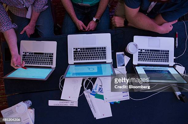 Attendees working on Apple Inc. Laptop computers participate in the Yahoo! Inc. Mobile Developer Conference Hackathon in New York, U.S., on Tuesday,...
