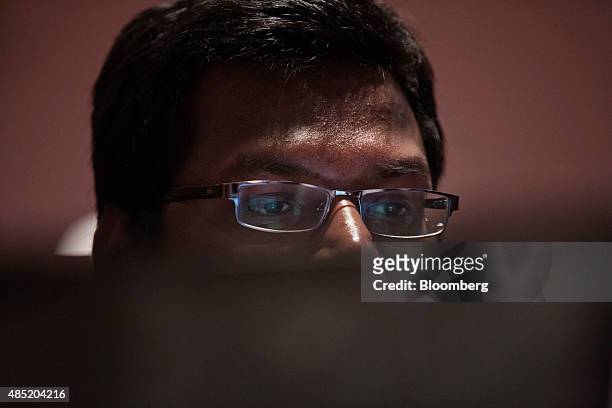 An attendee working on a laptop computer participates in the Yahoo! Inc. Mobile Developer Conference Hackathon in New York, U.S., on Tuesday, Aug....