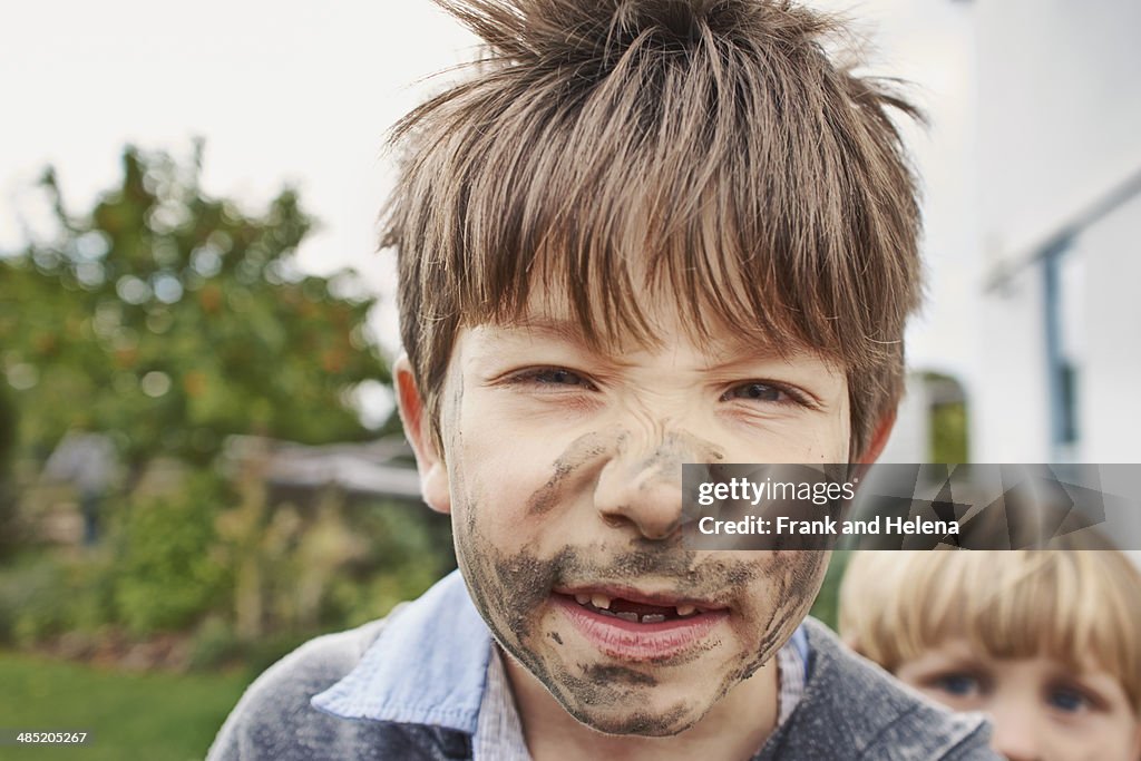 Boy with muddy face