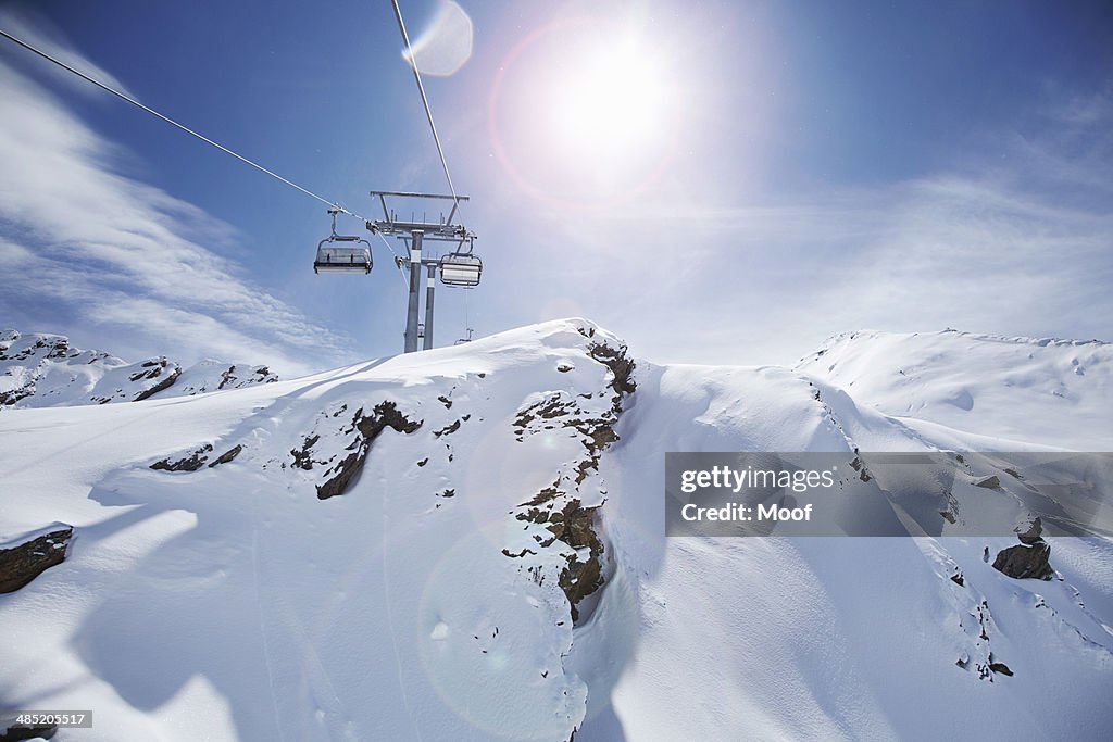 View of ski lift and snow covered mountains, Obergurgl, Austria