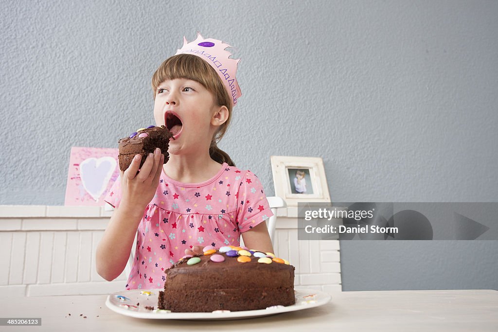 Girl eating her birthday cake