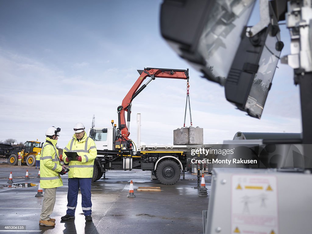 Emergency Response workers training with truck crane