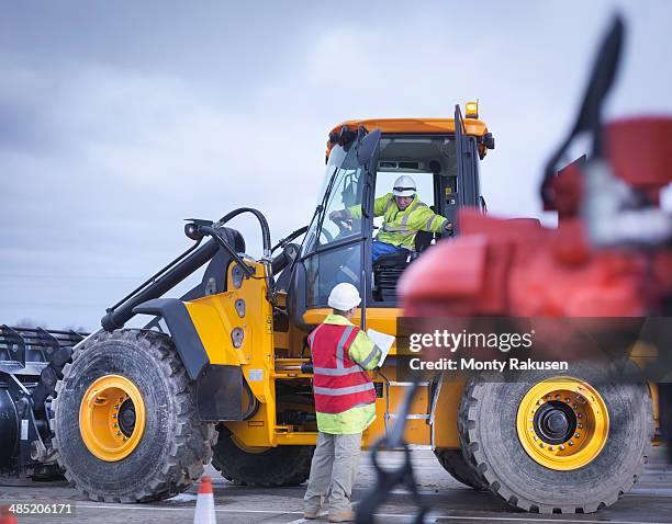 emergency response team workers training with digger - heysham stock pictures, royalty-free photos & images