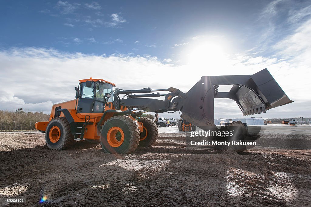 Emergency Response Team digger lifting blocks in training exercise