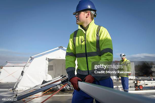 emergency response team workers erecting tent control centre - heysham stock pictures, royalty-free photos & images